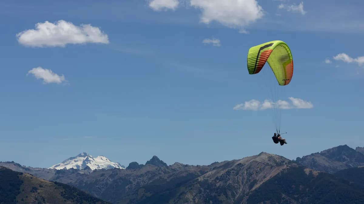 Paragliders with Cerro Tronador in the background