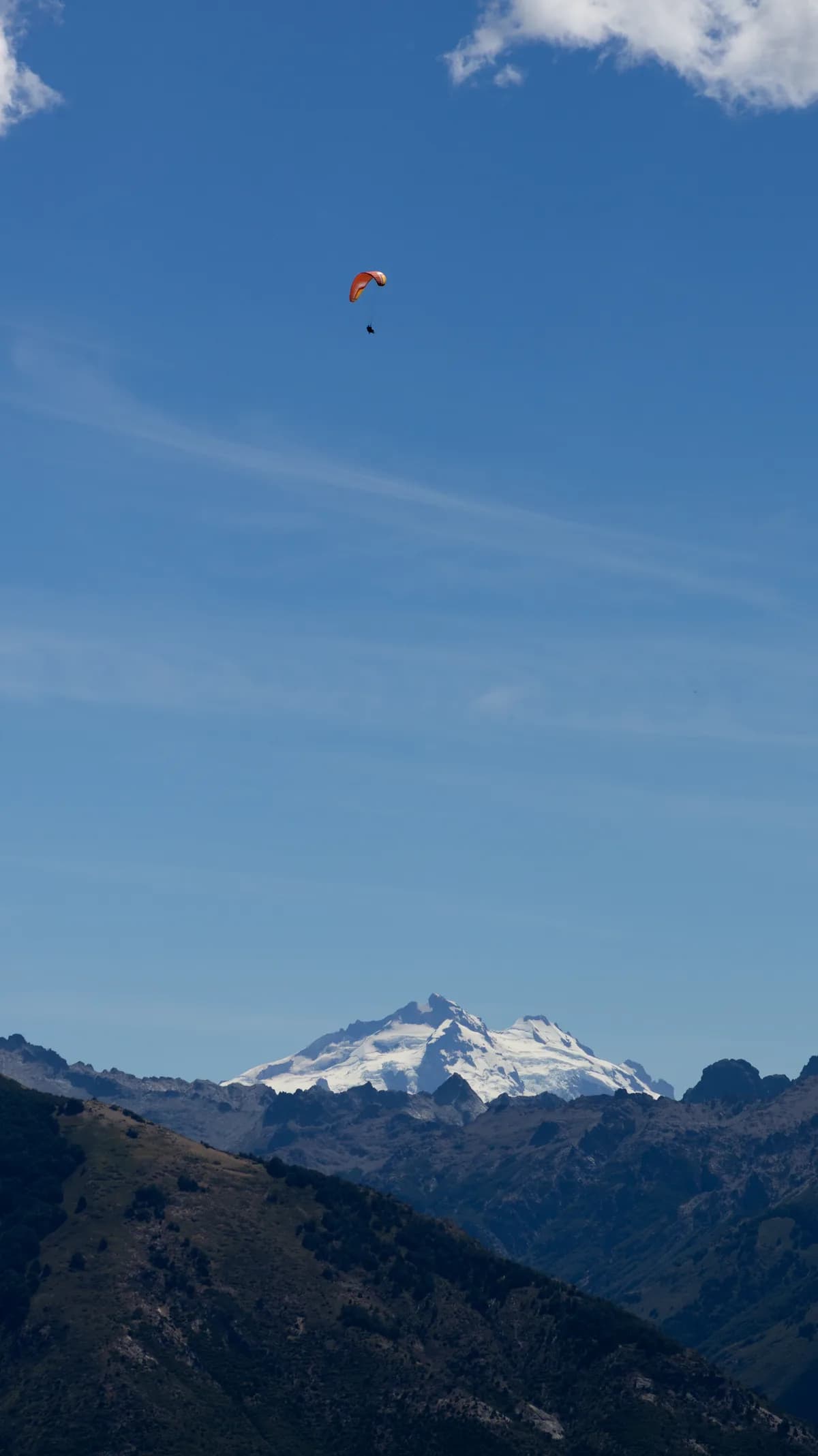 Paragliders looking small against Cerro Tronador