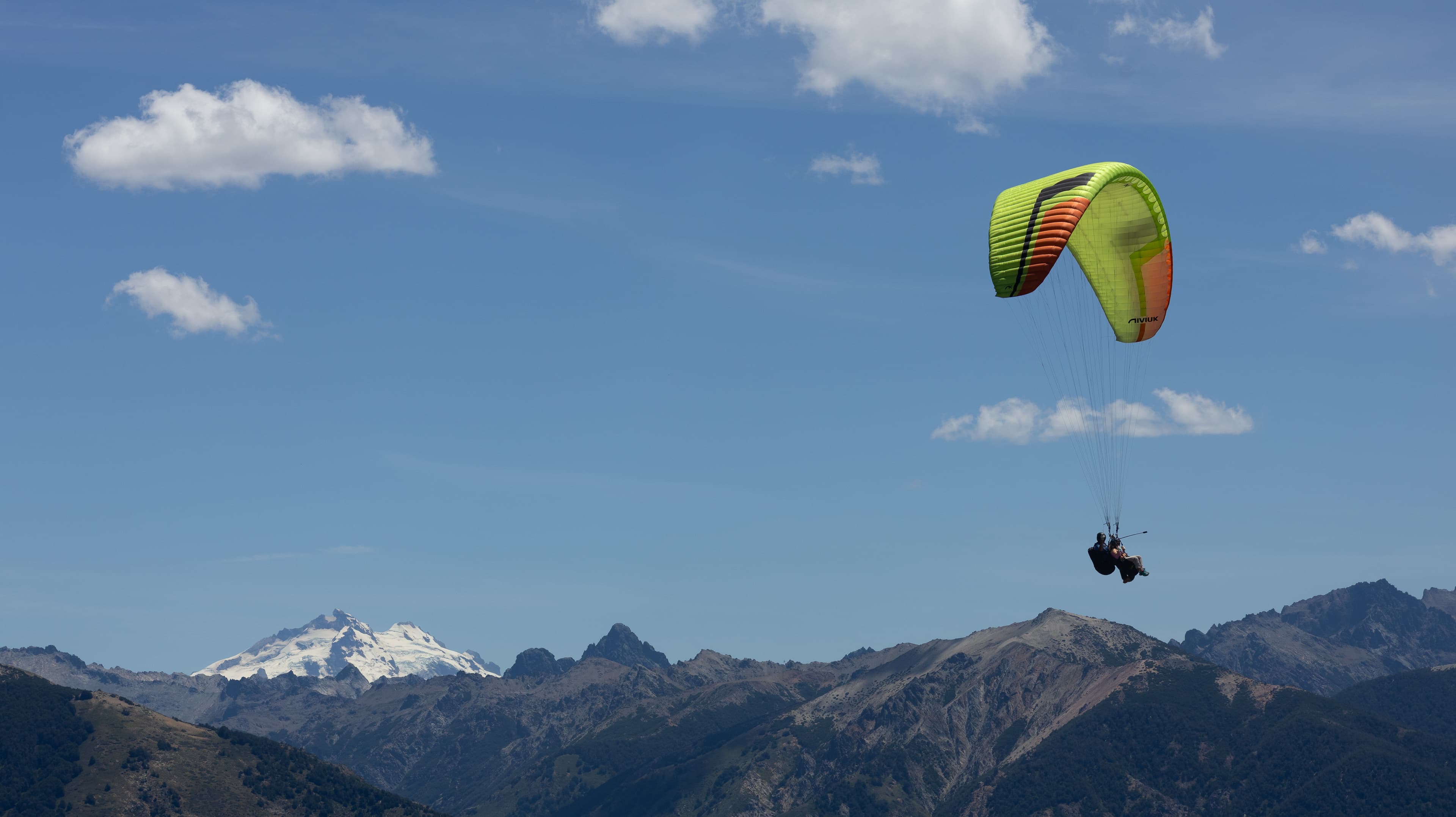Paragliders with Cerro Tronador in the background