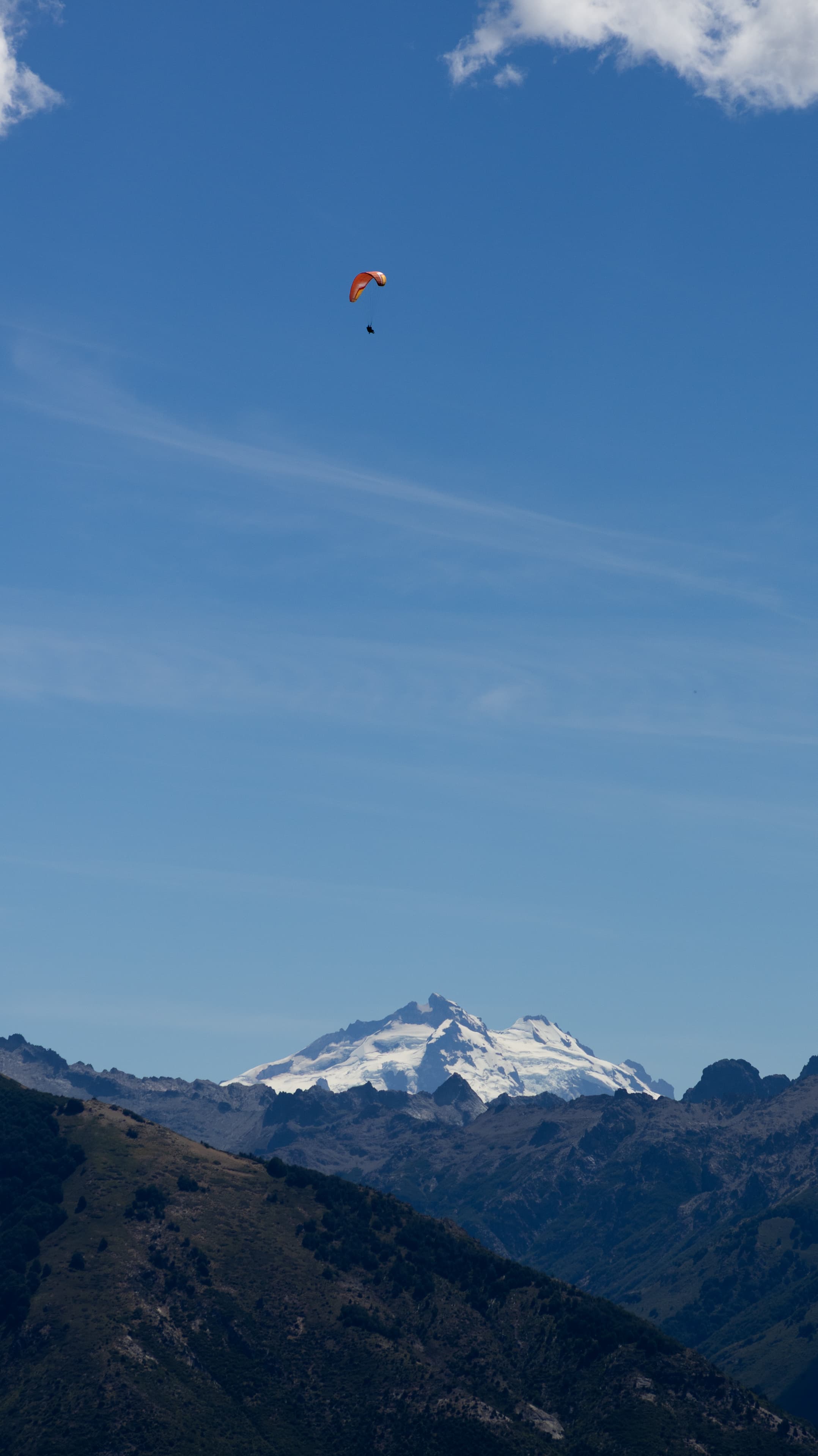 Paragliders looking small against Cerro Tronador